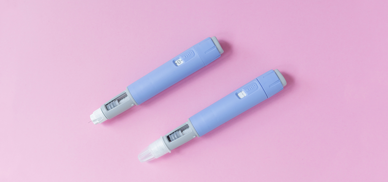 Two injectable cholesterol-lowering medication pens