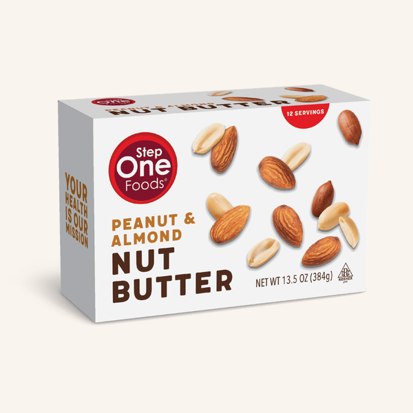A box of Step One Foods Peanut & Almond Nut Butter on a light cream background. The white box features illustrations of almonds and peanuts, with the brand logo in a red circle on the front.