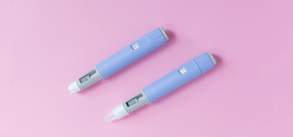 Two injectable cholesterol-lowering medication pens
