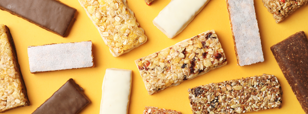 Rows of snack bars on a store shelf