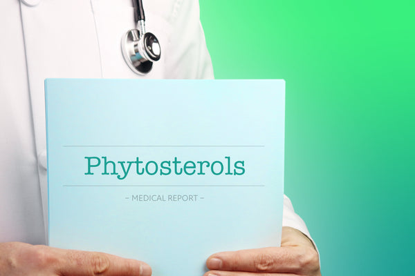 Doctor holding a medical report labeled Phytosterols