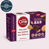 Box of Step One Foods Dark Chocolate Walnut Bar with Good Housekeeping Award badge on a light pink background