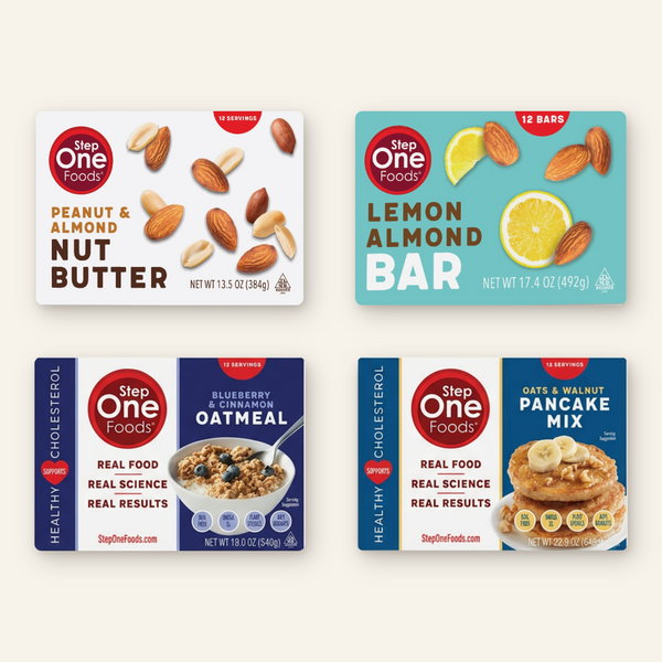 Four Step One Foods packaged food products arranged in a 2x2 grid on a black background: Peanut & Almond Nut Butter, Lemon Almond Bar, Blueberry & Cinnamon Oatmeal, and Oats & Walnut Pancake Mix.