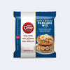 Front View of Whole Oats & Walnut Pancake Mix single package on a light grey colored background, 54g